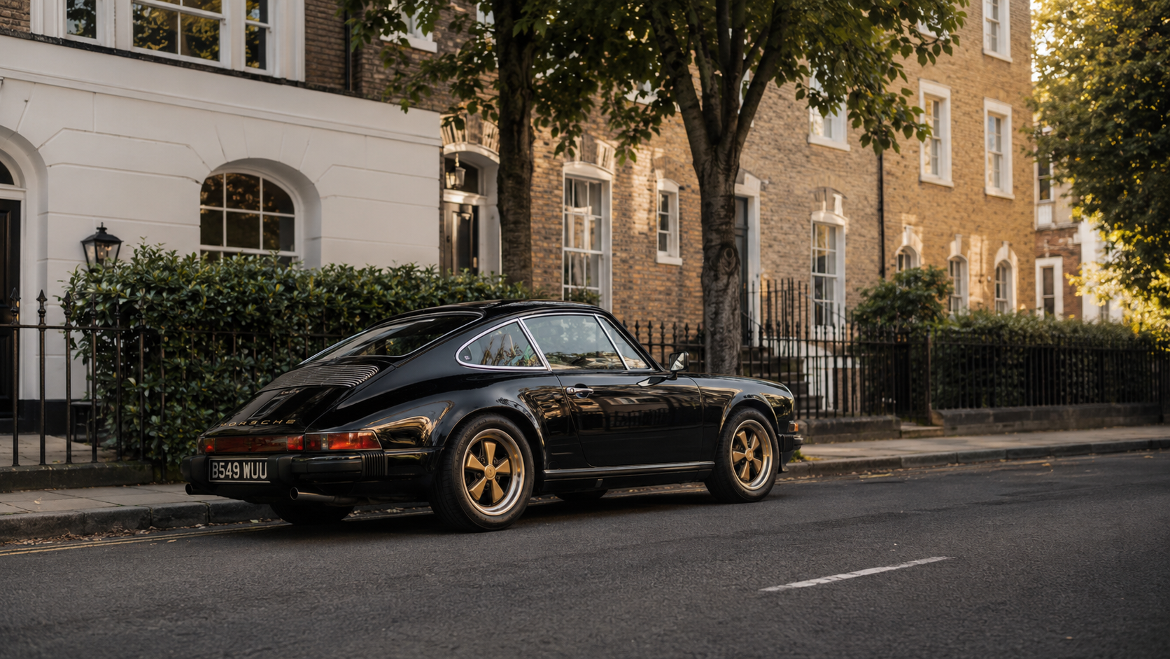 Black classic Porsche parked on a London street